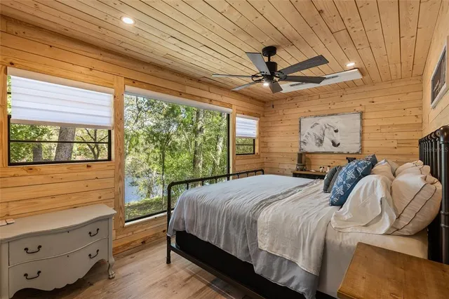 a bedroom with a bed and a dresser