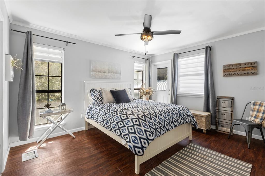 1069 Southeast Suwannee Trail Branford, FL 32008 - Photo 20 of 47 a bedroom with a bed and a table in it