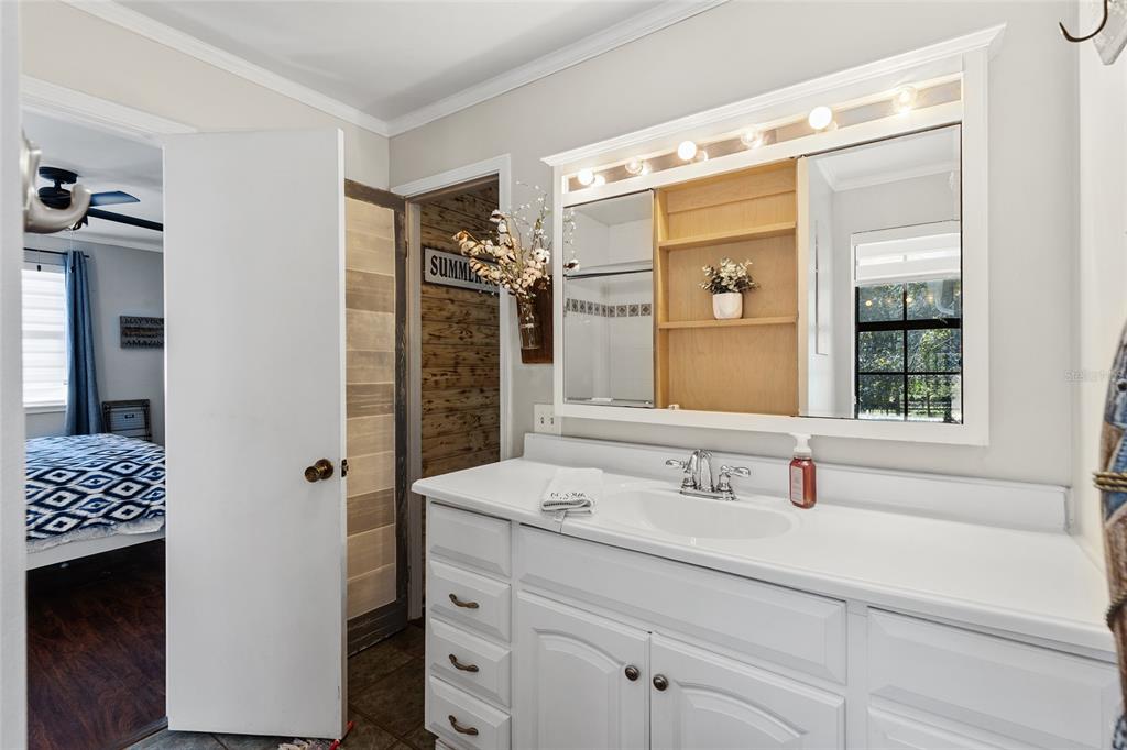 1069 Southeast Suwannee Trail Branford, FL 32008 - Photo 21 of 47 a bathroom with a sink and a mirror