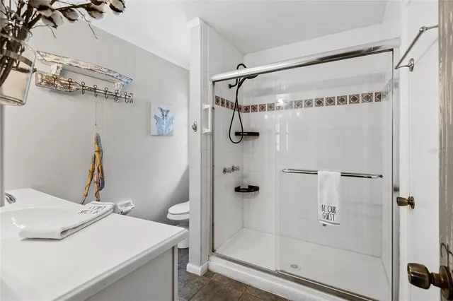 a bathroom with a shower and a sink