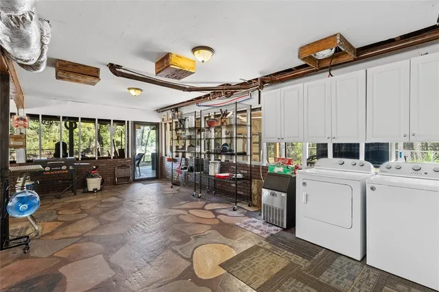 a bedroom with a bed dresser and a window