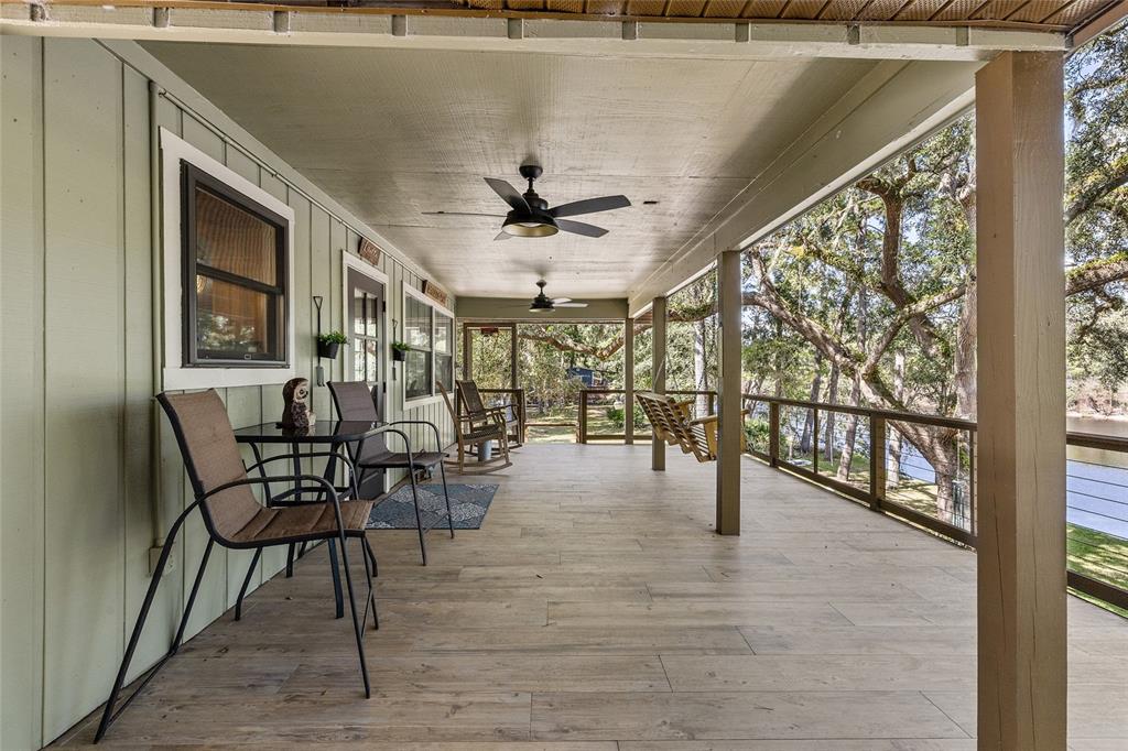 1069 Southeast Suwannee Trail Branford, FL 32008 - Photo 4 of 47 a view of a porch with chairs and backyard