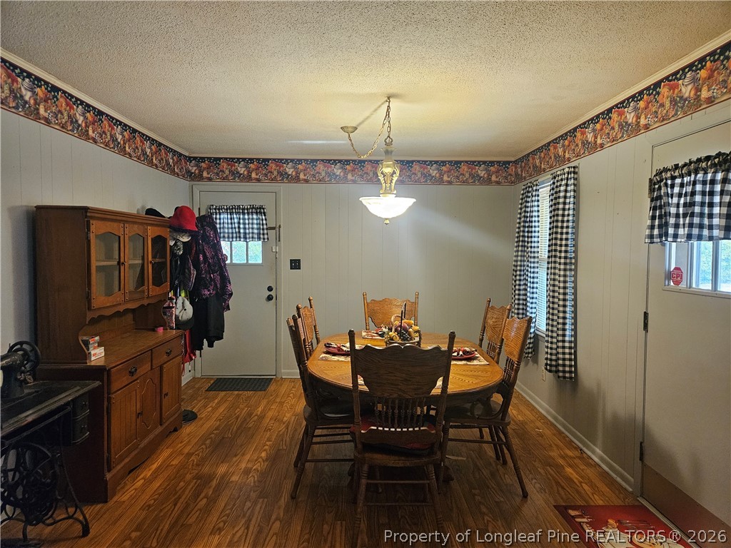 4547 Legion Road Hope Mills, NC 28348 - Photo 9 of 28 a view of a dining room with furniture and wooden floor