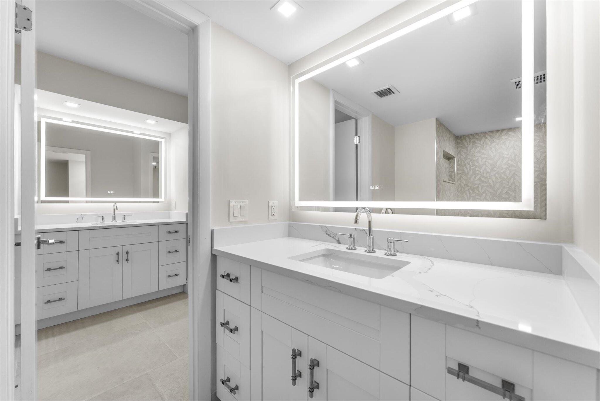 6562 Boca Del Mar Drive, Unit 222 Boca Raton, FL 33433 - Photo 13 of 39 a bathroom with a sink and a mirror