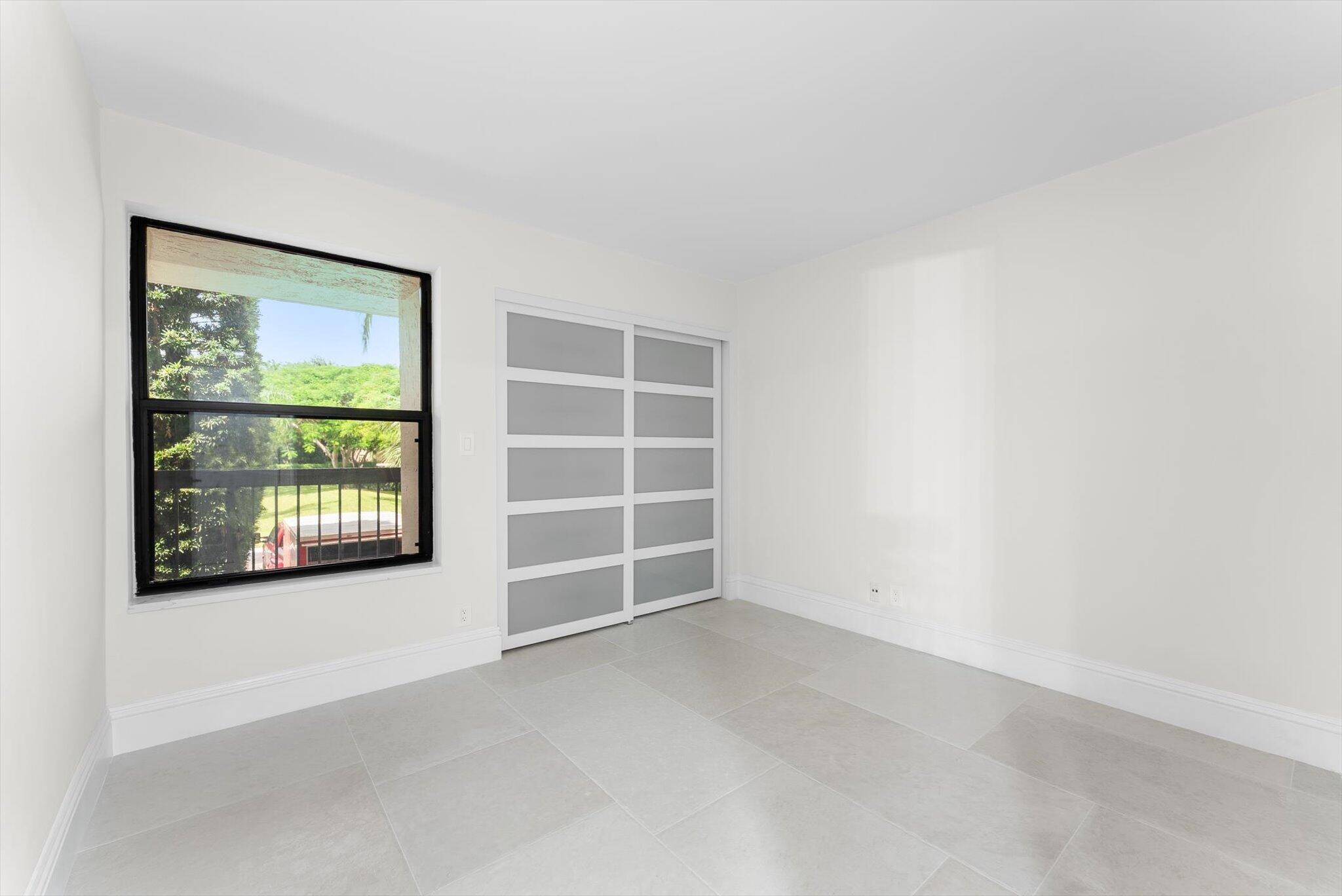 6562 Boca Del Mar Drive, Unit 222 Boca Raton, FL 33433 - Photo 16 of 39 an empty room with a window