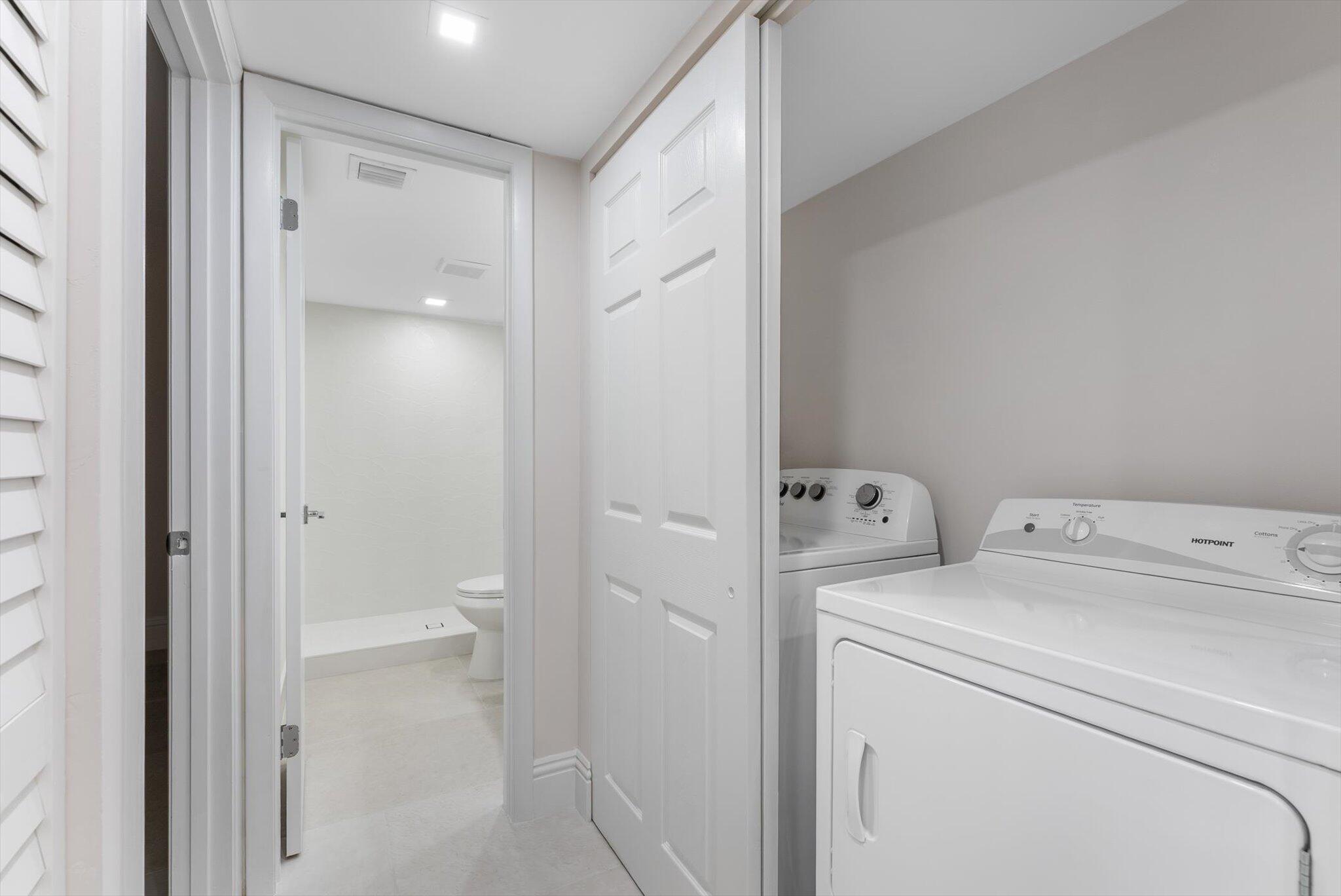6562 Boca Del Mar Drive, Unit 222 Boca Raton, FL 33433 - Photo 21 of 39 a view of storage and utility room with washer and dryer