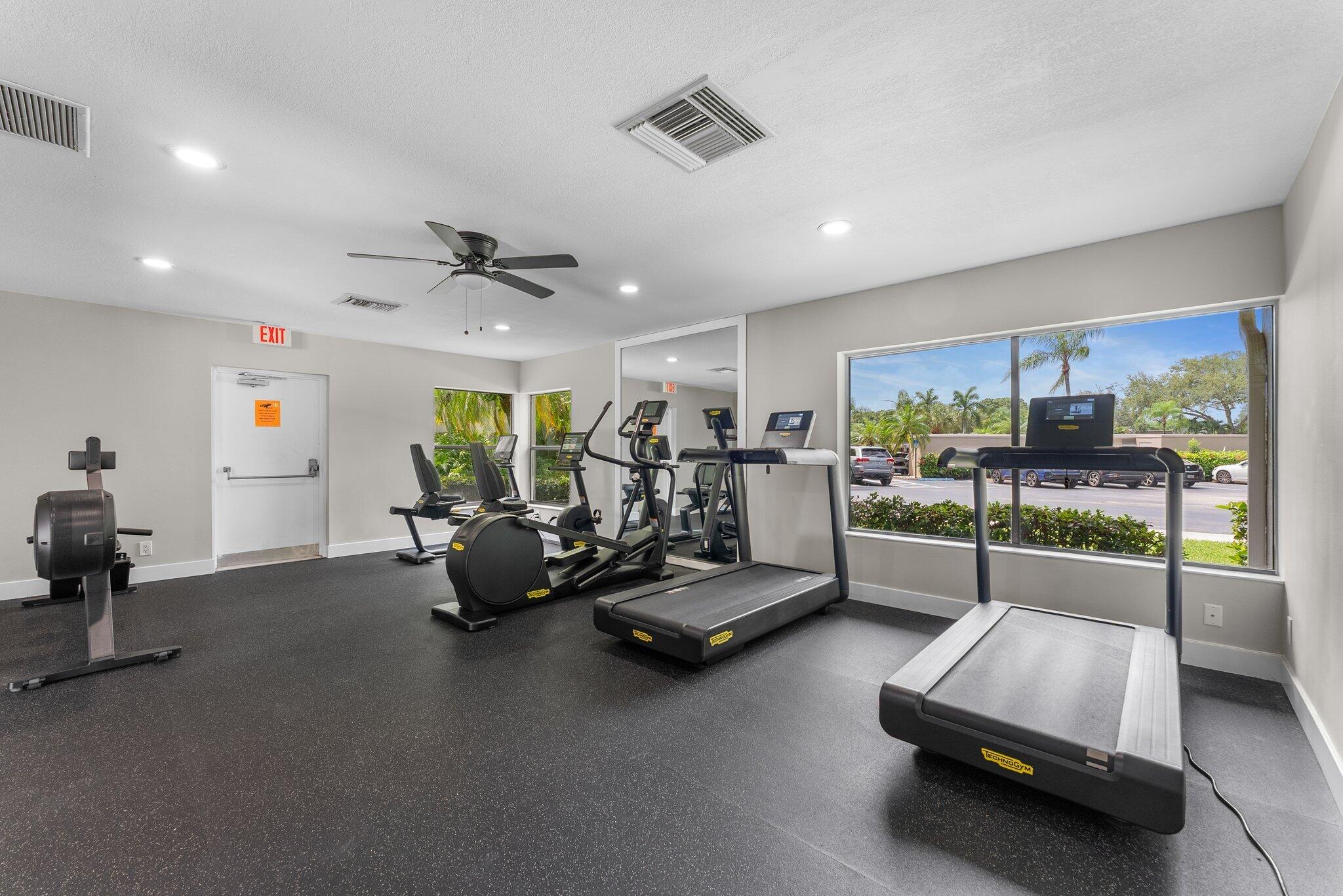 6562 Boca Del Mar Drive, Unit 222 Boca Raton, FL 33433 - Photo 28 of 39 a room with gym equipment and a large window