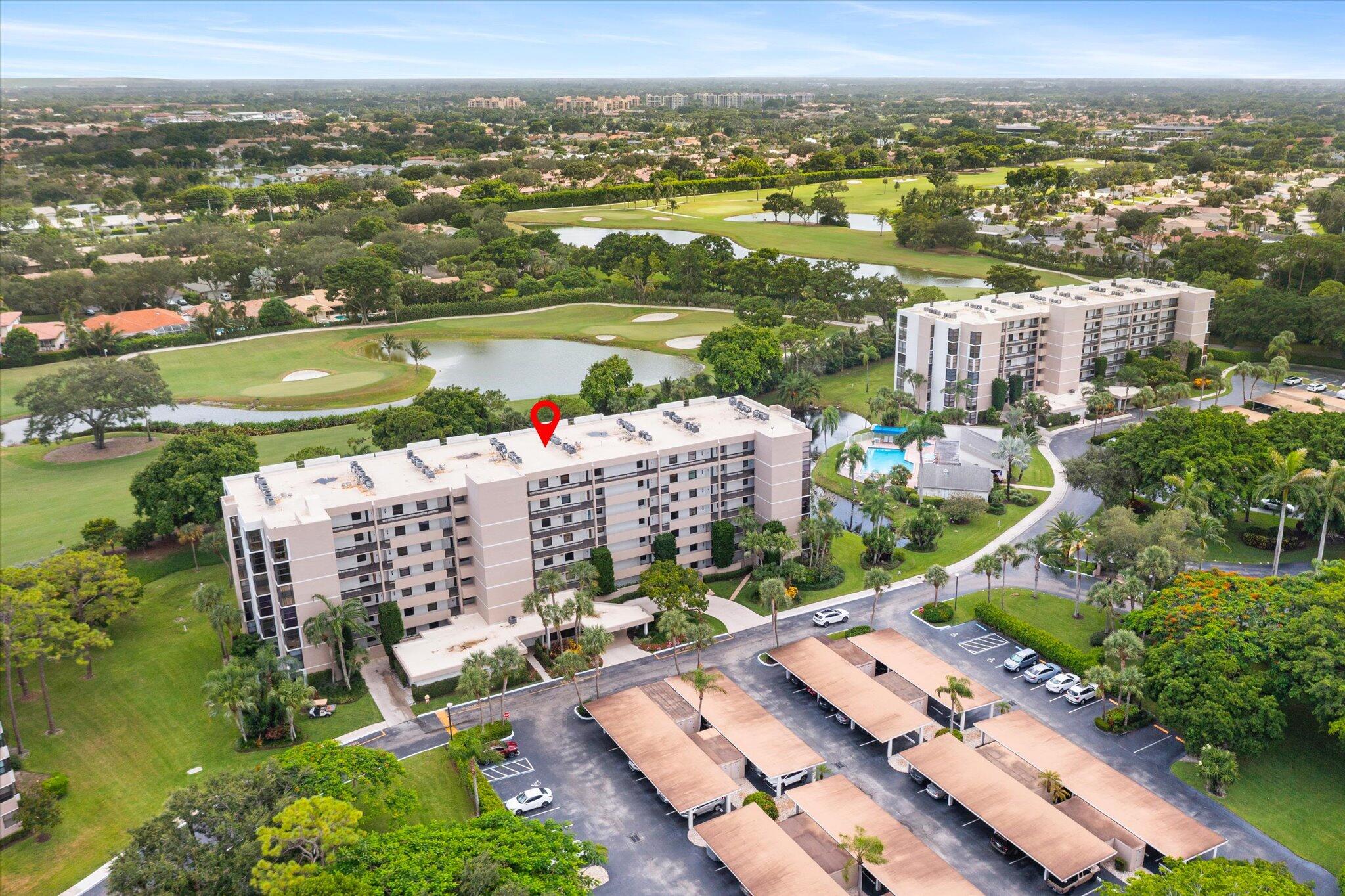 6562 Boca Del Mar Drive, Unit 222 Boca Raton, FL 33433 - Photo 3 of 39 an aerial view of a city with lots of residential buildings lake and ocean view