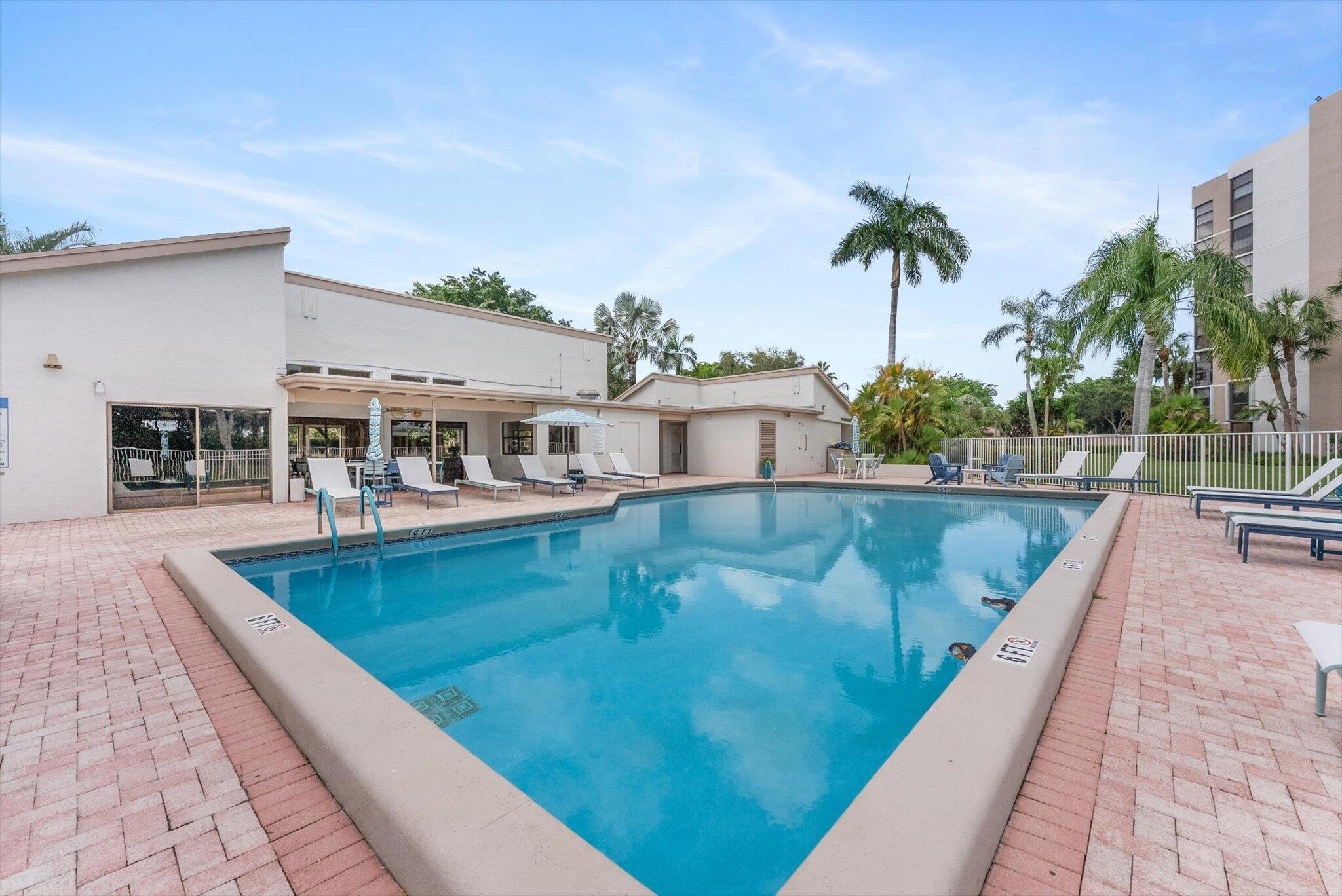 6562 Boca Del Mar Drive, Unit 222 Boca Raton, FL 33433 - Photo 30 of 39 a view of a house with swimming pool