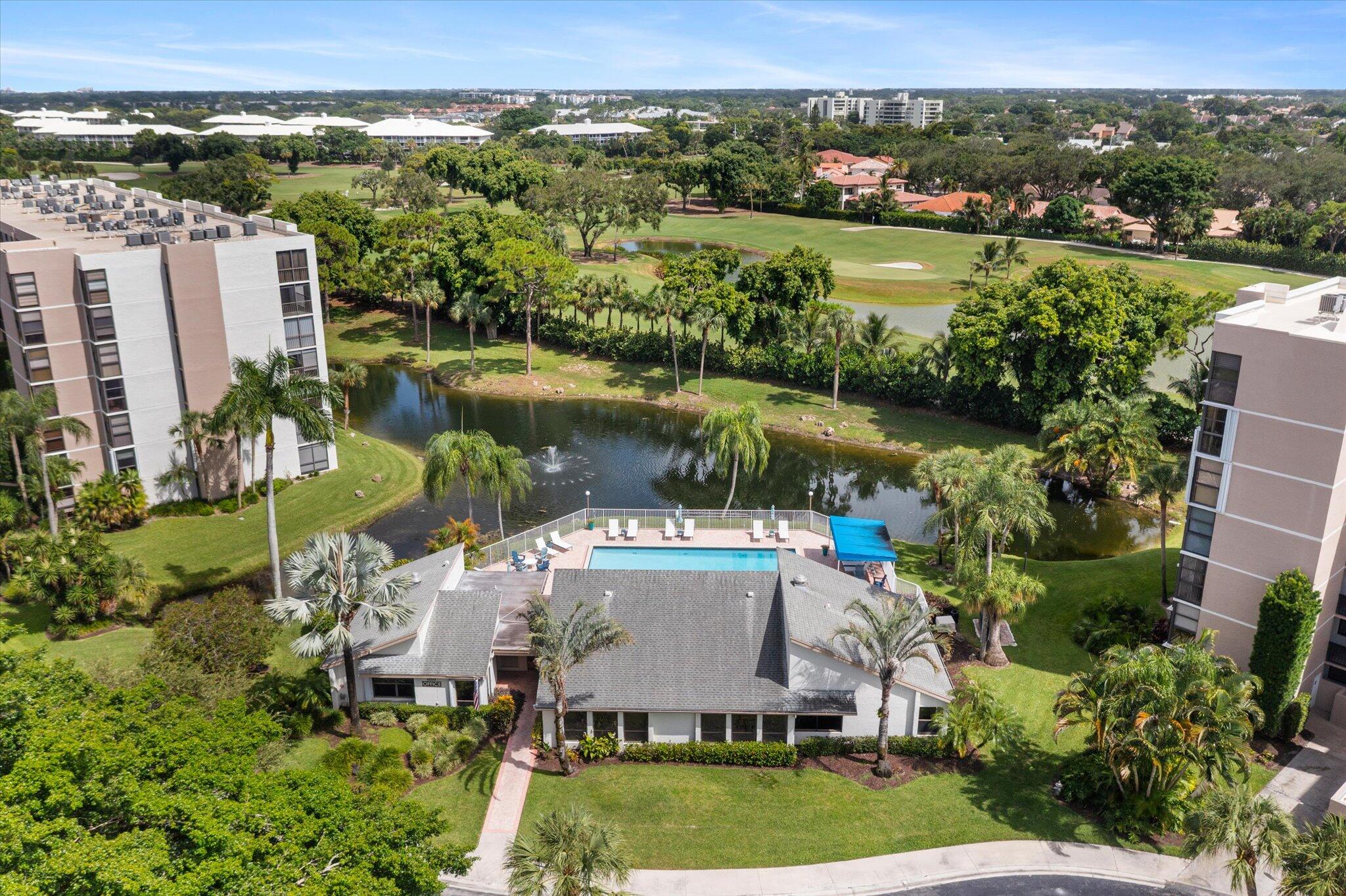 6562 Boca Del Mar Drive, Unit 222 Boca Raton, FL 33433 - Photo 33 of 39 an aerial view of a house with a yard and lake view