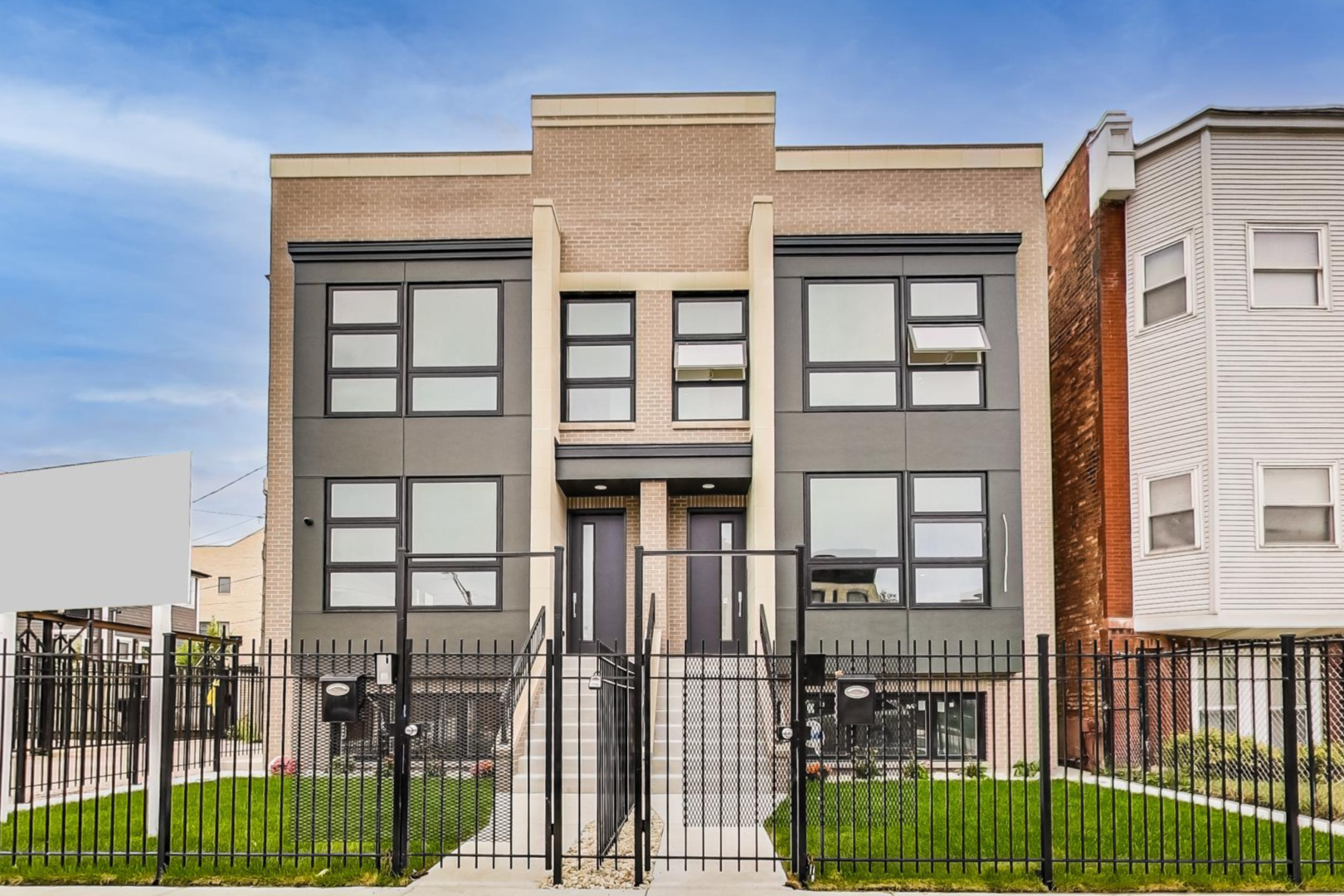 4244 South Champlain Avenue Chicago, IL 60653 - Photo 1 of 34 a view of a brick house with large windows