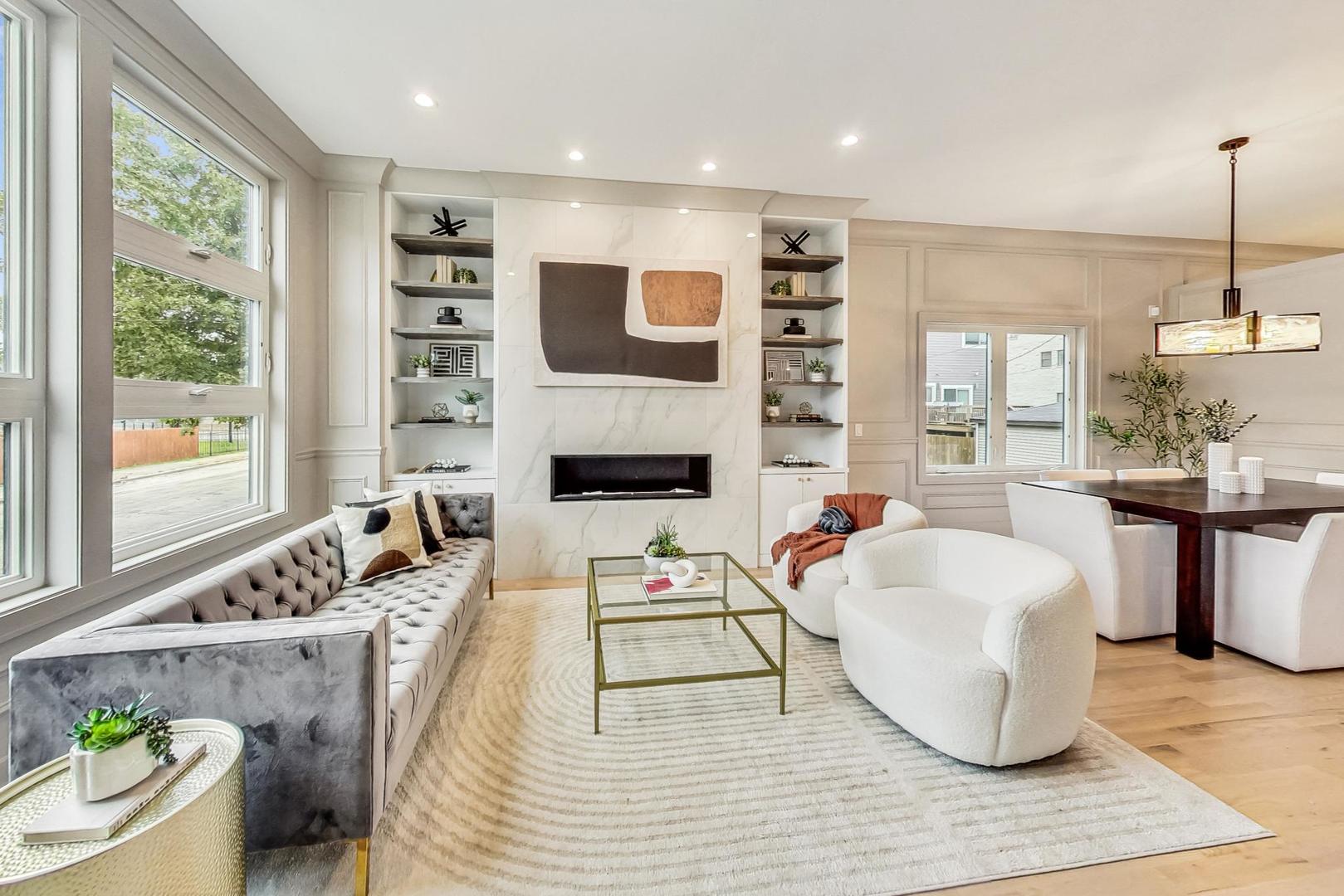 4244 South Champlain Avenue Chicago, IL 60653 - Photo 2 of 34 a living room with furniture and a fireplace