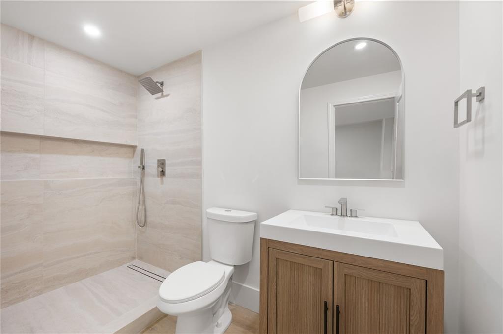 8120 Ball Mill Road Northeast Atlanta, GA 30350 - Photo 70 of 95 a bathroom with a sink a toilet and shower