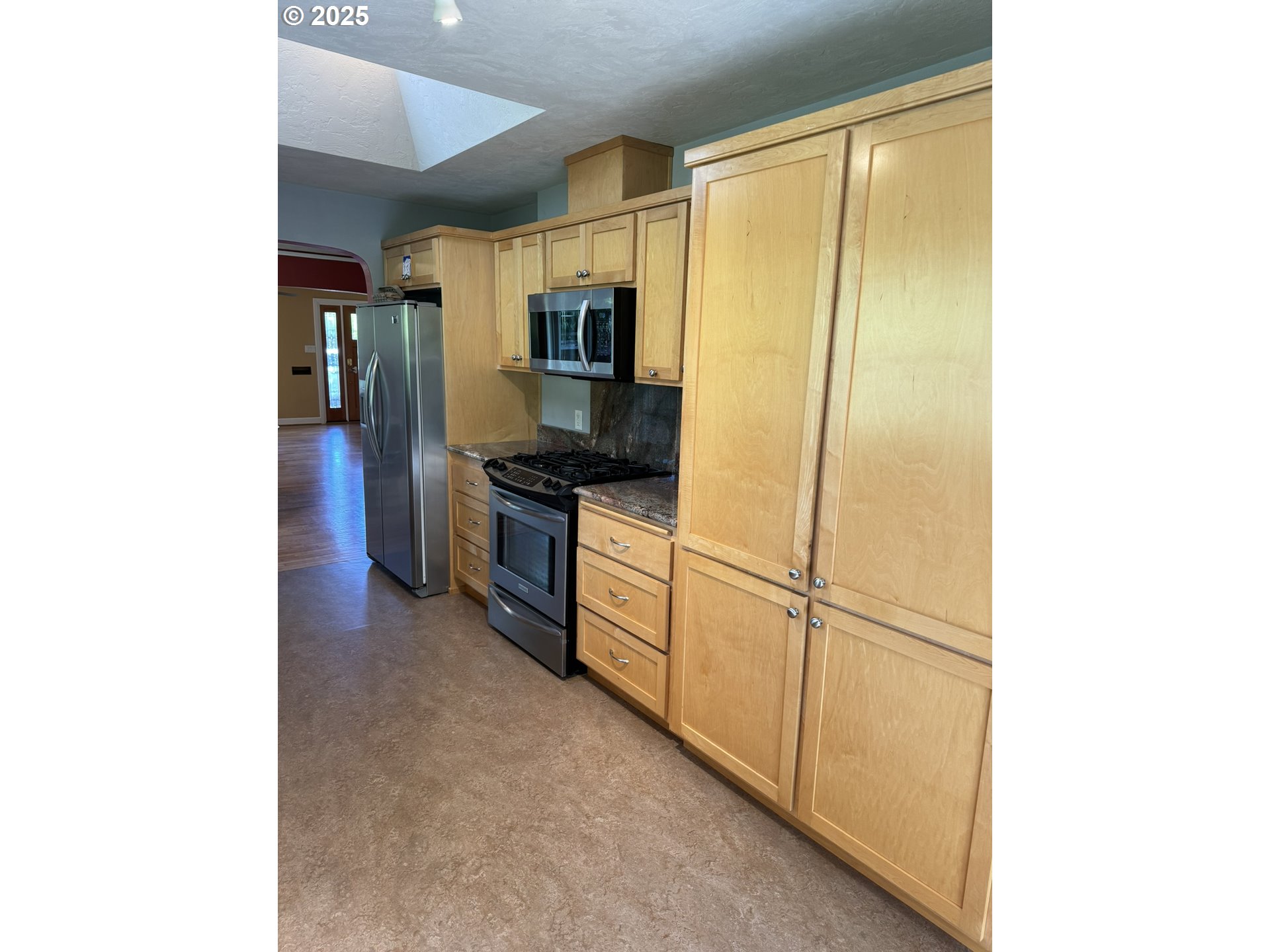 810 East 20th Avenue Eugene, OR 97405 - Photo 12 of 30 a kitchen with stainless steel appliances granite countertop a refrigerator and a sink