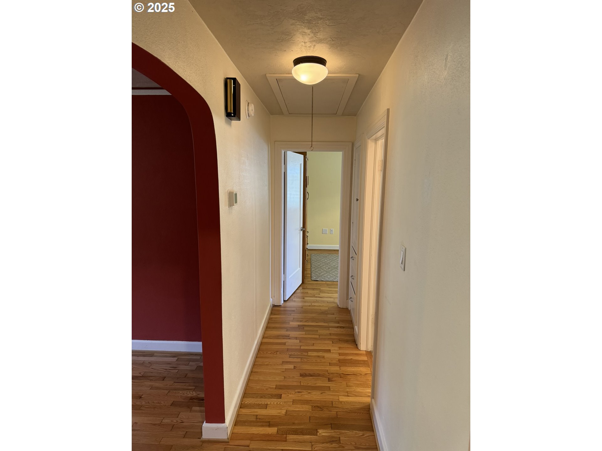 810 East 20th Avenue Eugene, OR 97405 - Photo 22 of 30 a view of a hallway with wooden floor