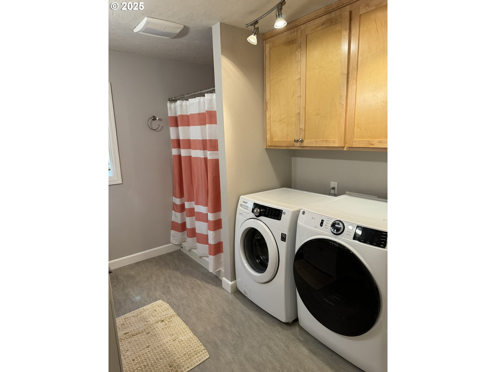 810 East 20th Avenue Eugene, OR 97405 - Photo 23 of 30 a view of storage and utility room with washer and dryer