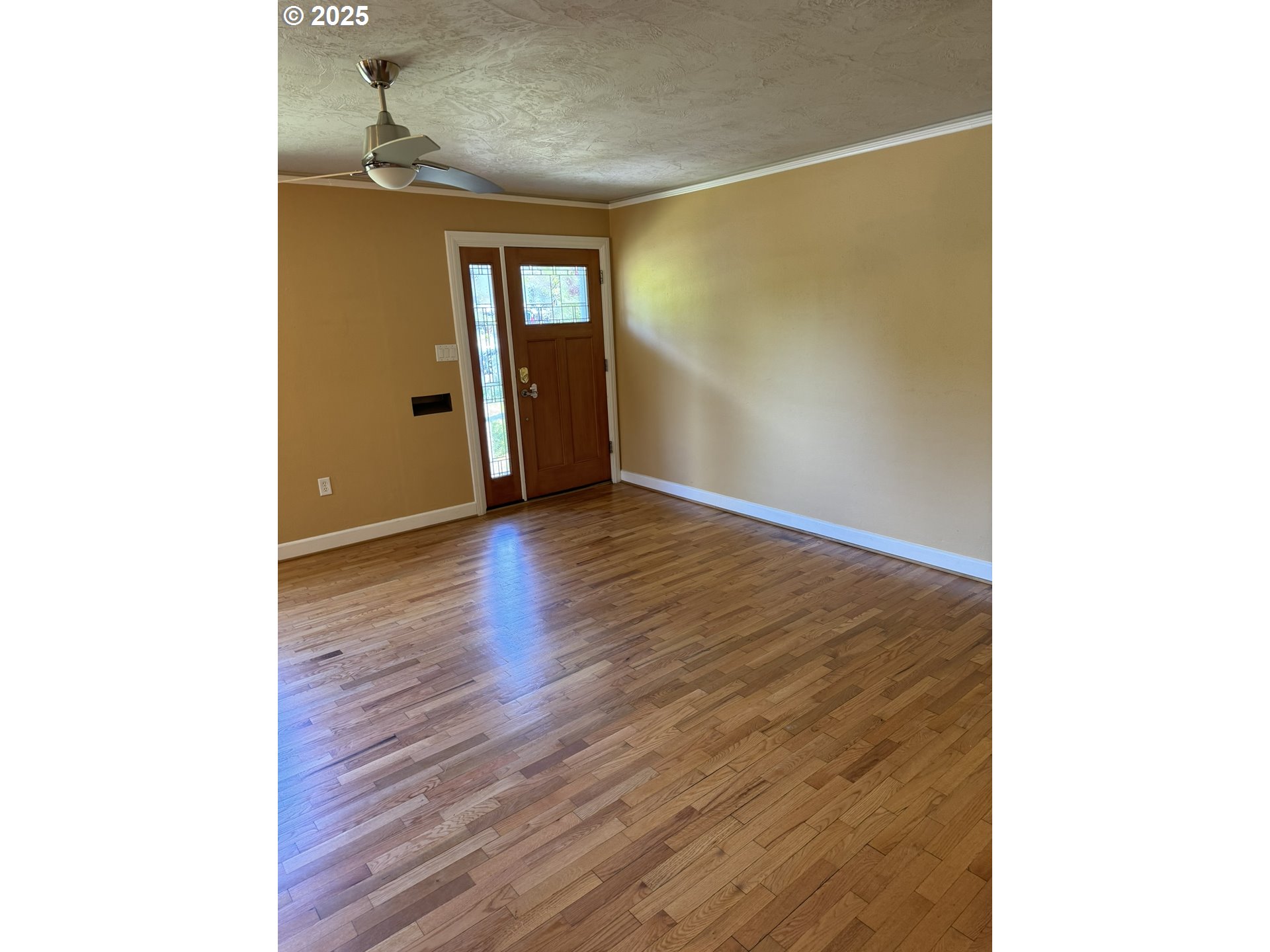 810 East 20th Avenue Eugene, OR 97405 - Photo 6 of 30 a view of an empty room with wooden floor and a window