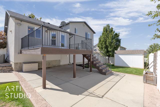 704 West Vahe Street Draper, UT 84020 - Photo 31 of 35 Elevated deck with dark railings and staircase