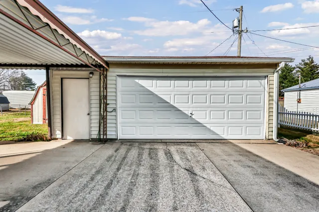 a front view of a house with a garage