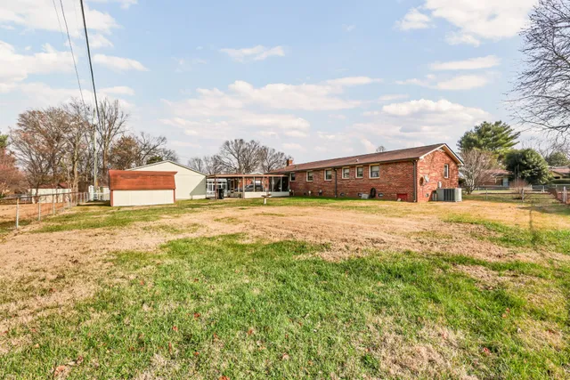 a swimming pool with outdoor seating