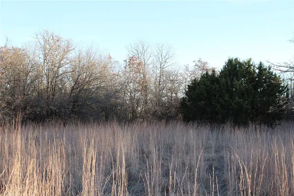 a view of a lake with top of house