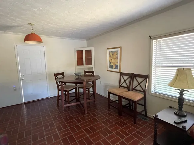 a view of a livingroom with furniture and a table
