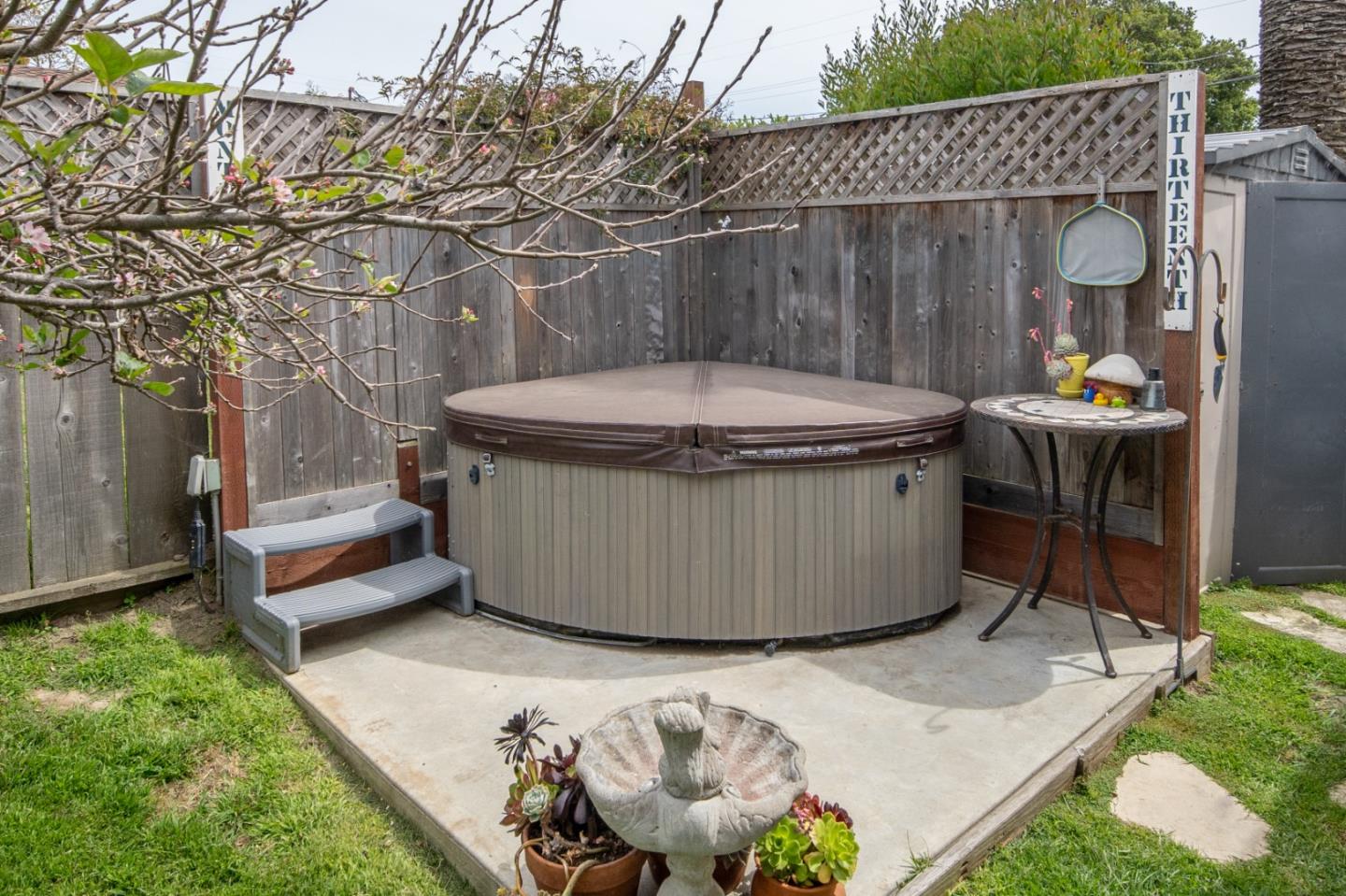 3445 Rio Road Carmel, CA 93923 - Photo 14 of 16 a view of a backyard with a tub and wooden fence