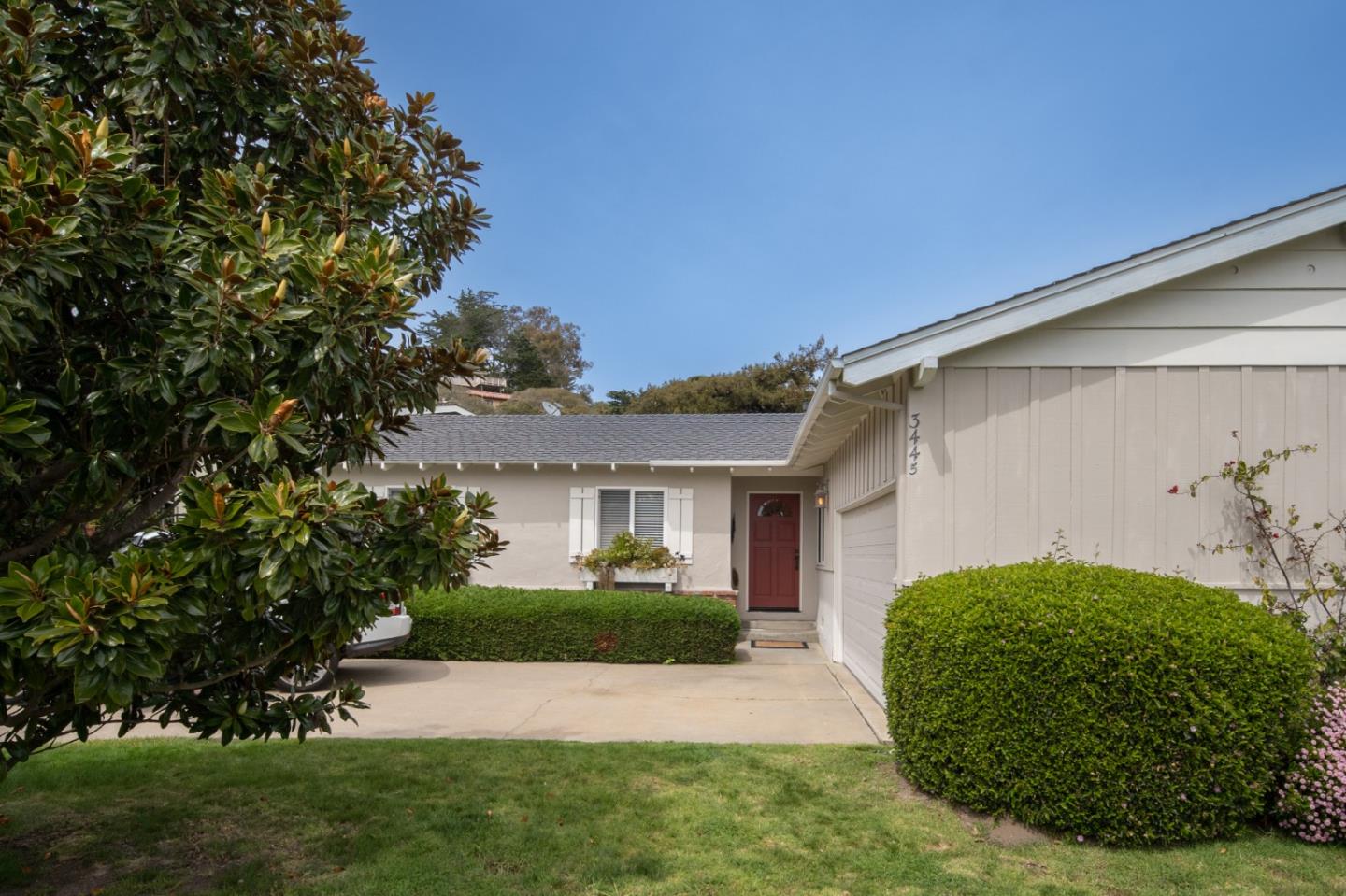 3445 Rio Road Carmel, CA 93923 - Photo 16 of 16 a view of house in front of a yard with potted plants