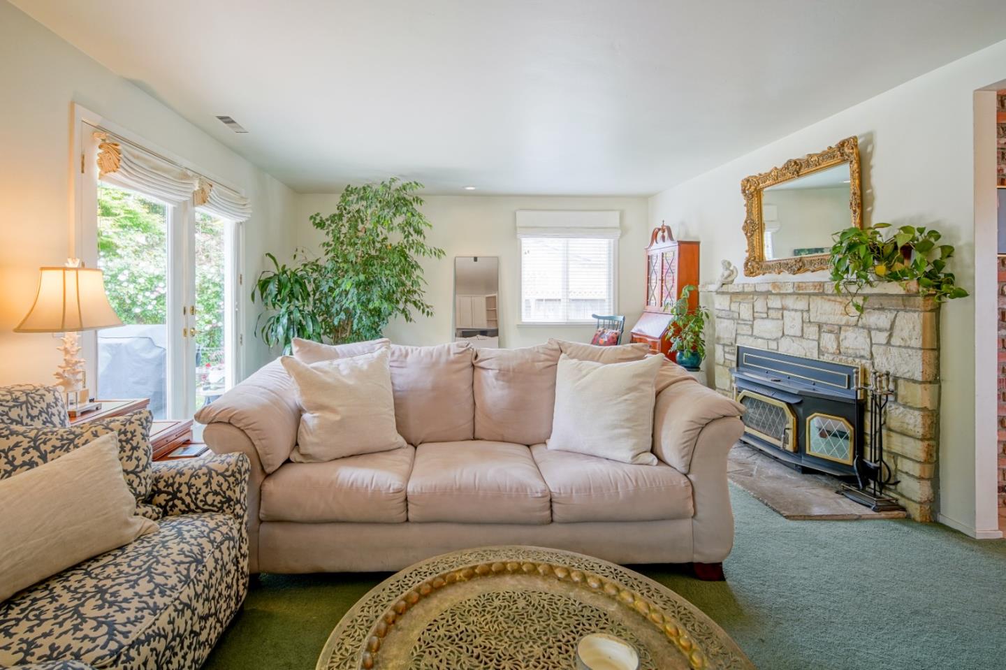 3445 Rio Road Carmel, CA 93923 - Photo 5 of 16 a living room with furniture a fireplace and a window