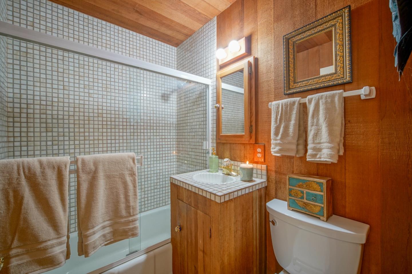 3445 Rio Road Carmel, CA 93923 - Photo 10 of 16 a bathroom with a toilet sink and mirror