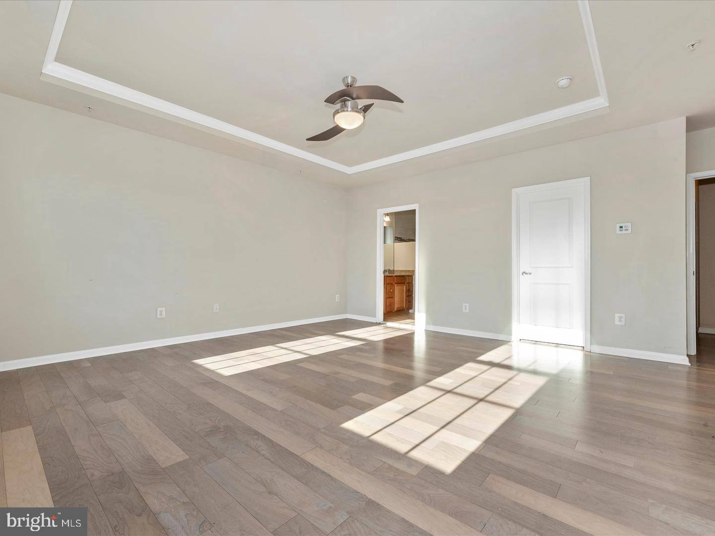 208 B Mill Pond Road Frederick, MD 21701 - Photo 23 of 45 wooden floor in an empty room with a window