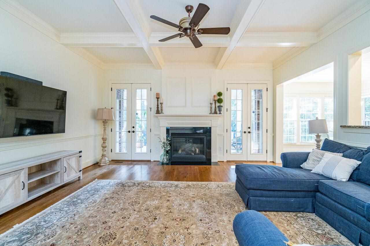 3820 Laurel Hills Road Raleigh, NC 27612 - Photo 8 of 30 Coffered ceiling, fan, fireplace, updated trim work, neutral paint make this living room ready for you! Living Room