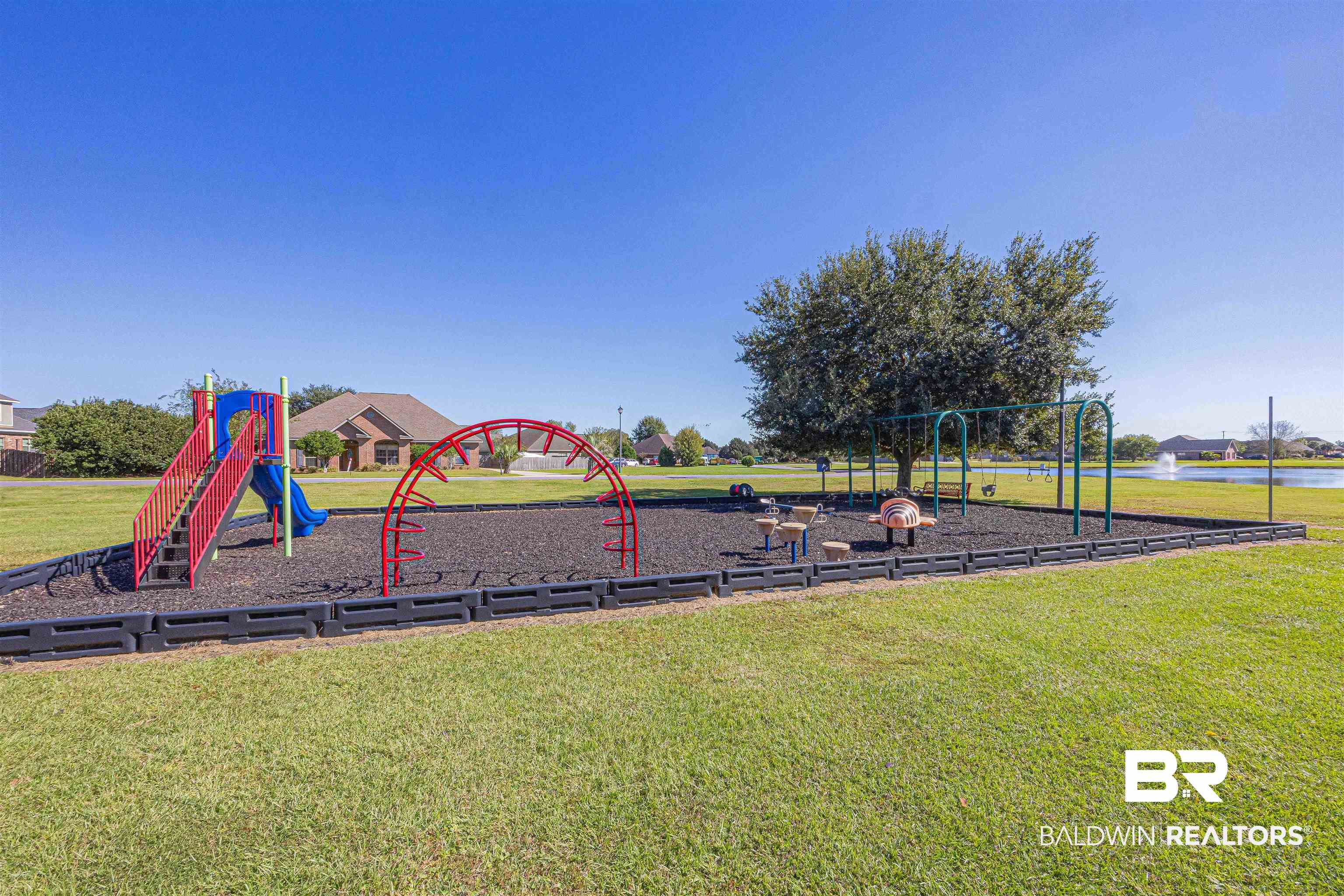 25234 Fairfax Road Daphne, AL 36526 - Photo 40 of 45 Community jungle gym with a lawn