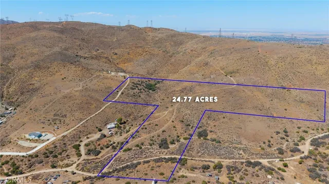 a view of a dry yard with mountain