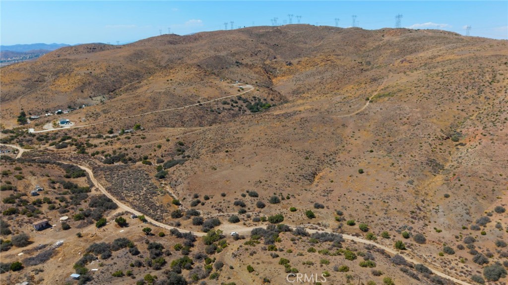 0 East Soledad Pass Road Palmdale, CA 93550 - Photo 4 of 12 a view of a dry yard with mountains in the background