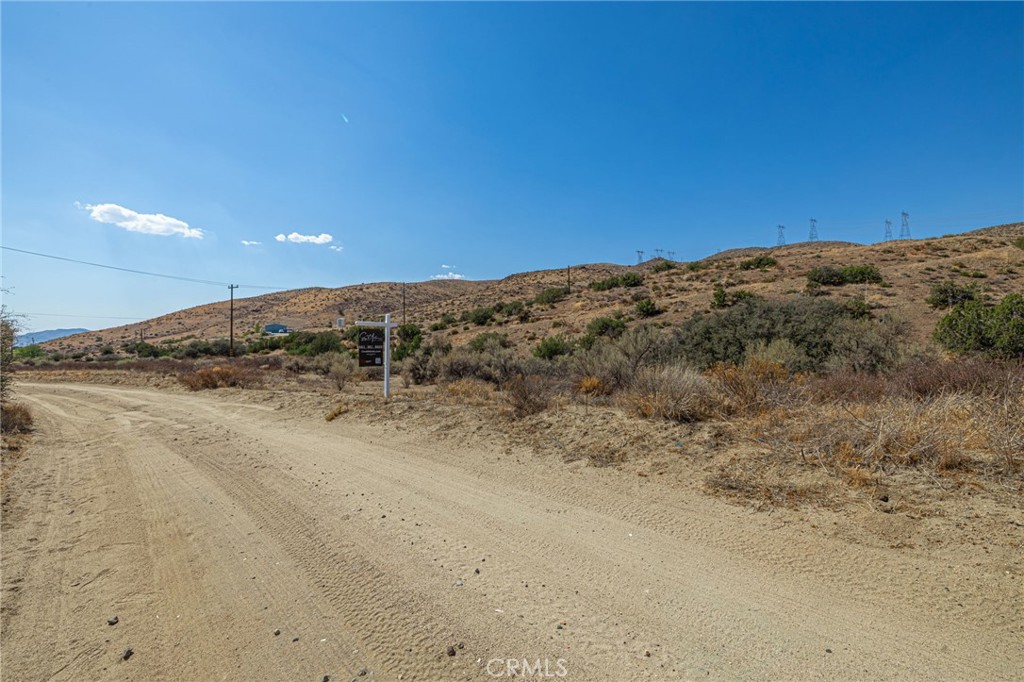0 East Soledad Pass Road Palmdale, CA 93550 - Photo 7 of 12 a view of a dry yard with mountain in the background