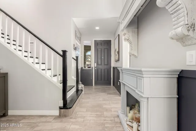 a living room with furniture kitchen view and a table