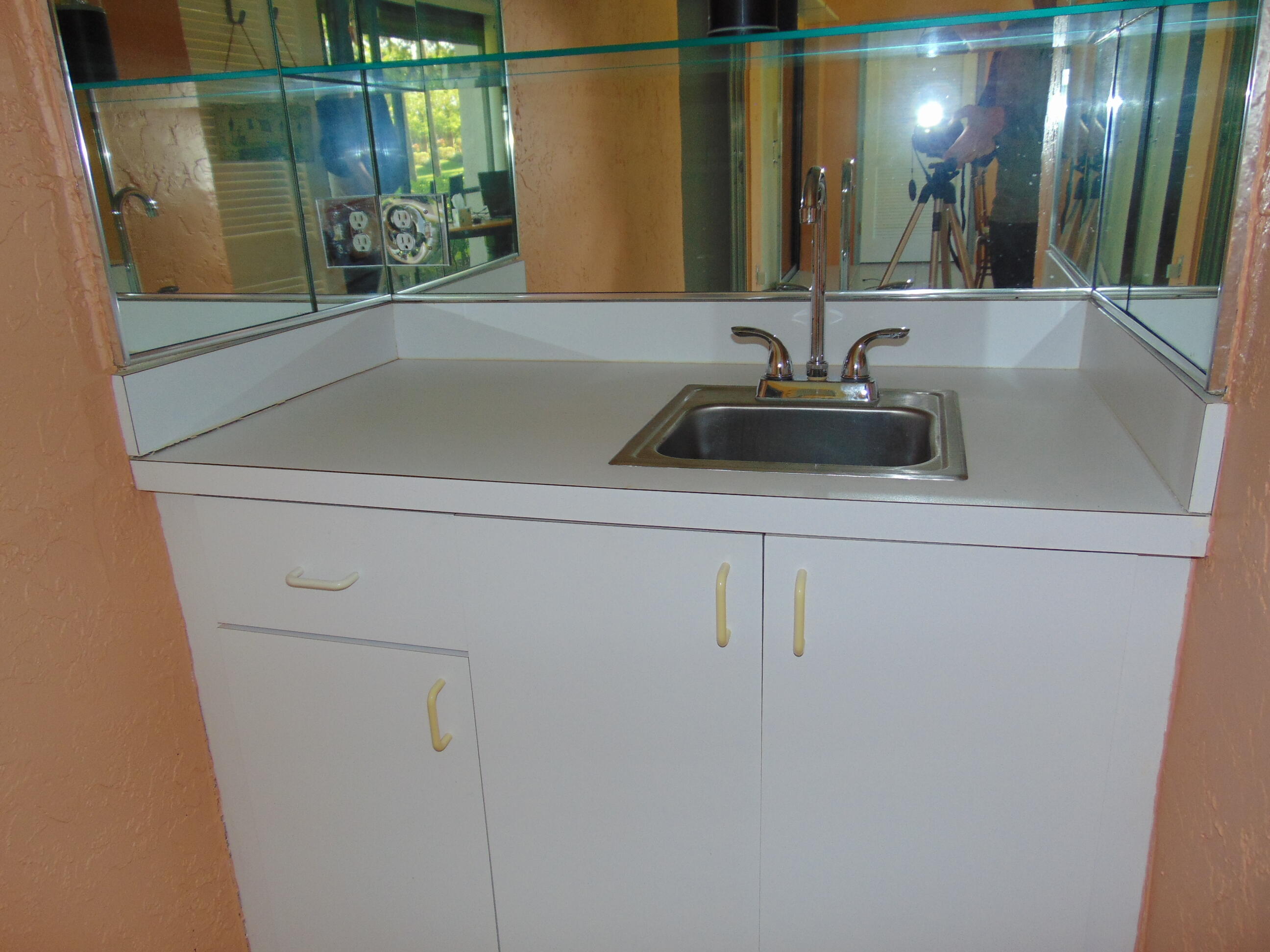 9220 Southwest 14th Street, Unit 3103 Boca Raton, FL 33428 - Photo 9 of 58 a bathroom with a sink and a mirror