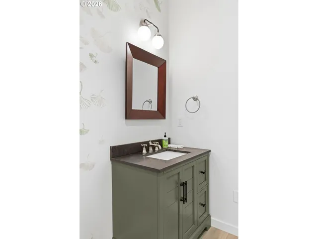 a bathroom with a sink and a mirror