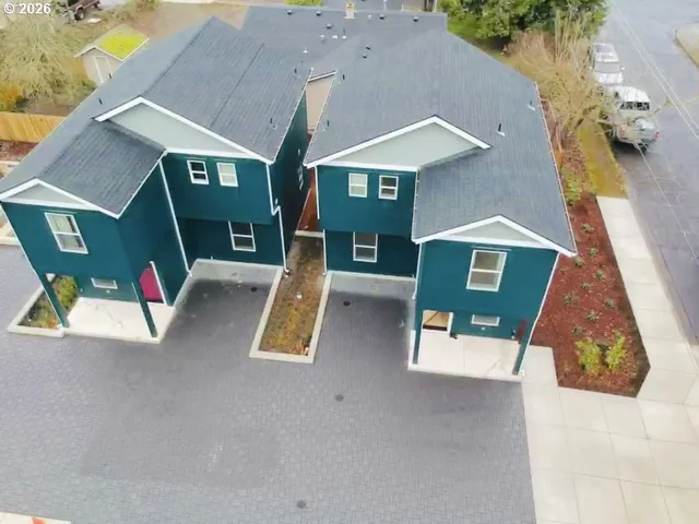 an aerial view of a house with swimming pool