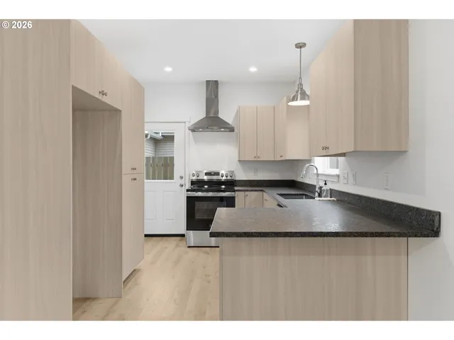 a kitchen with stainless steel appliances granite countertop a granite counter tops and a sink