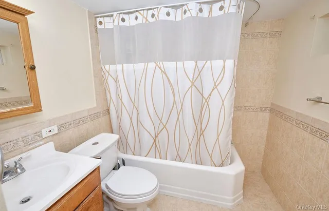 a bathroom with a toilet and a sink