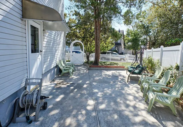 a view of a backyard with sitting area