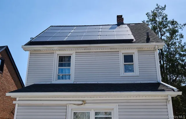 a view of a house with a roof deck