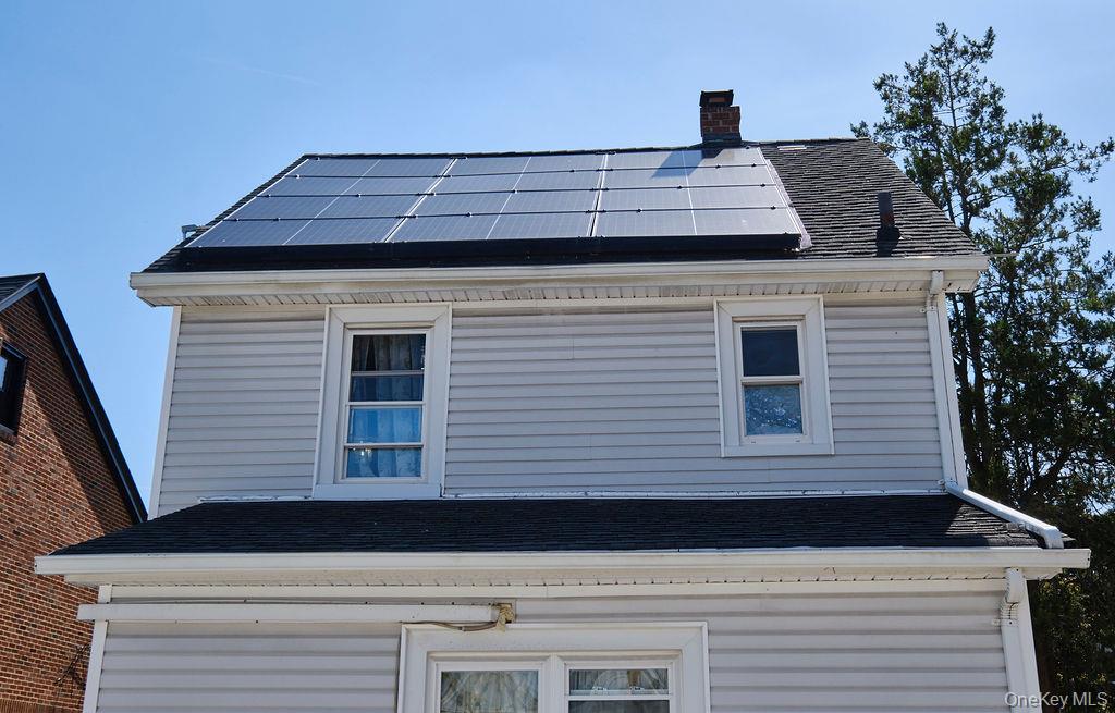 230-09 87th Avenue Queens, NY 11427 - Photo 17 of 22 a view of a house with a roof deck