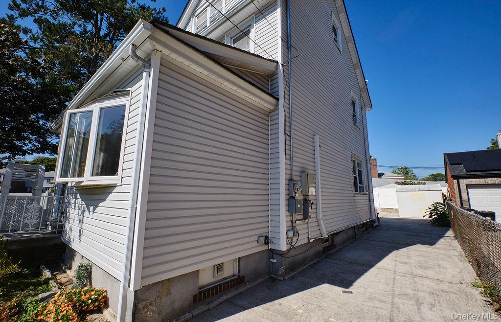 230-09 87th Avenue Queens, NY 11427 - Photo 18 of 22 a view of a house with a patio