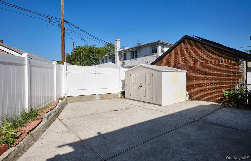 230-09 87th Avenue Queens, NY 11427 - Photo 19 of 22 a backyard of a house with potted plants
