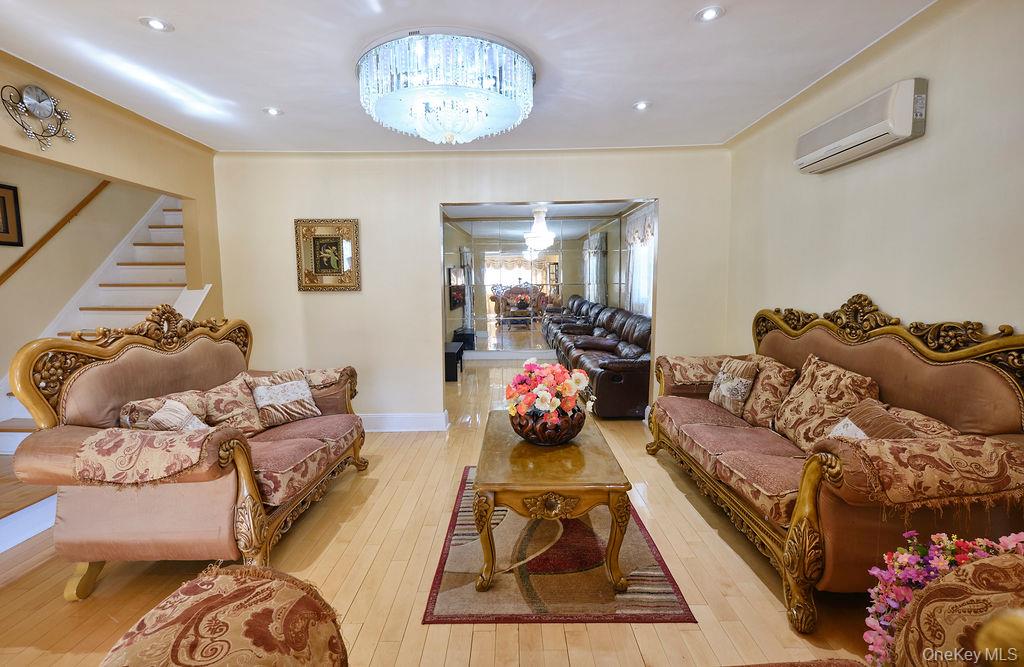 230-09 87th Avenue Queens, NY 11427 - Photo 2 of 22 a living room with furniture