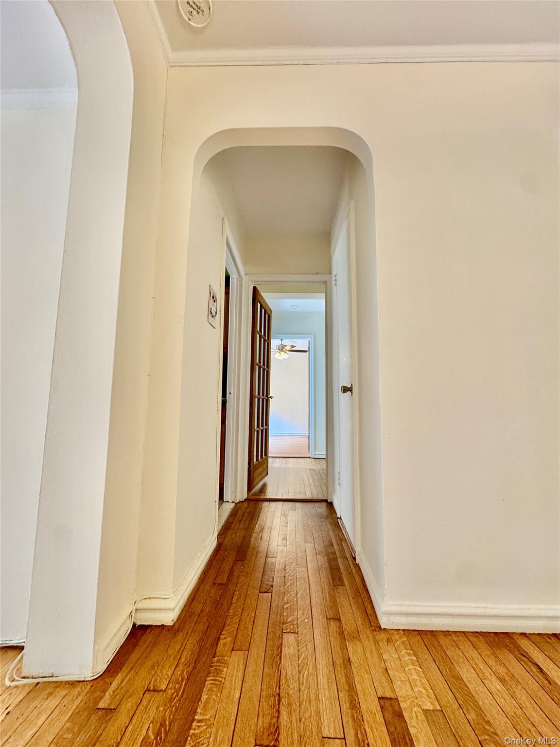 113-14 72nd Road, Unit 1M Queens, NY 11375 - Photo 8 of 20 a view of a hallway with wooden floor