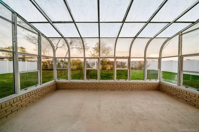 a view of an empty room with a balcony